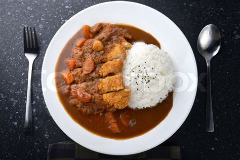 Rice with deep fried pork and curry . | Stock image | Colourbox