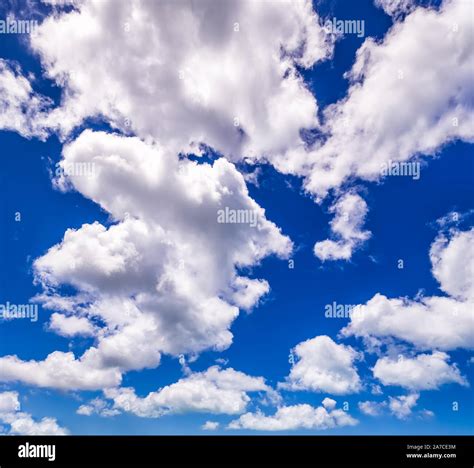 Blue sky background with fluffy white clouds beautifully shaped Stock ...