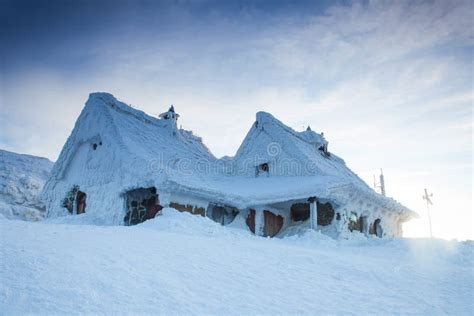 Snowy Houses with Mountains in the Background Stock Photo - Image of ...