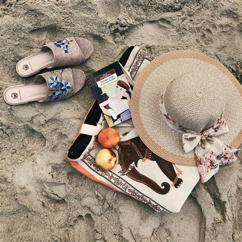 Brown Sun Hat And Sandals On Sand · Free Stock Photo