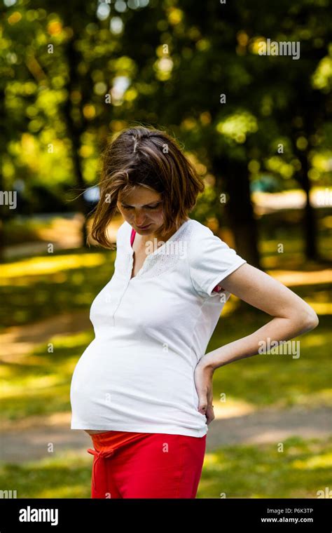 The tired pregnant woman Stock Photo - Alamy