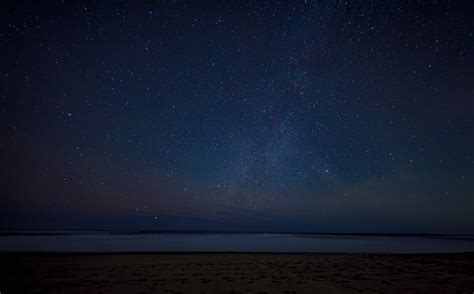 Stars on Night Sky over Sea Coast · Free Stock Photo