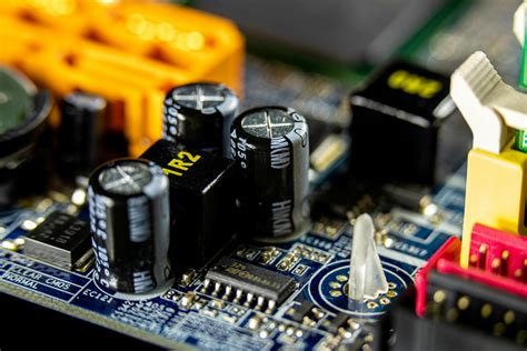 Black Capacitors On A Circuit Board · Free Stock Photo