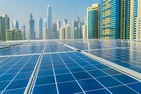 Premium Photo | Solar panels on a buildings roof with urban skyscrapers ...