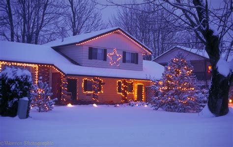 Snowy house with Christmas lights photo WP02926