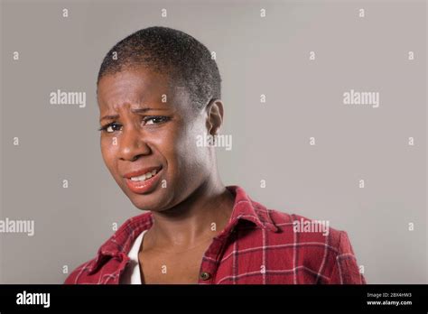 lifestyle portrait if young unhappy and pretty afro American woman in ...