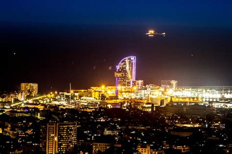 Premium Photo | Night view of the city of barcelona from a hill