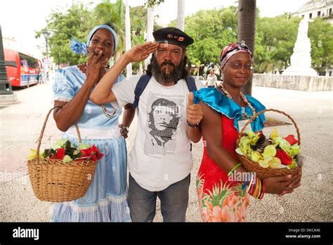 Local Cuban people dressed up and posing for tourists, Havana, Cuba ...