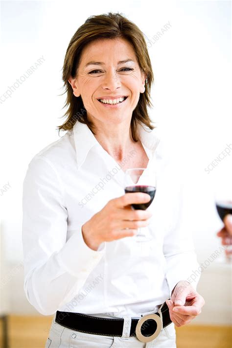 Woman drinking wine - Stock Image - C031/4417 - Science Photo Library