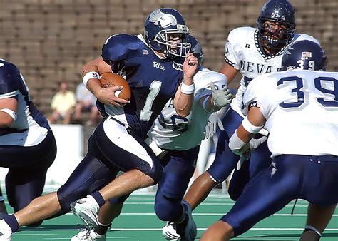 Football Players in Blue Jersey Lined Under Grey White Cloudy Sky ...