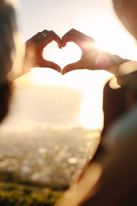 Romantic couple making a finger heart – Jacob Lund Photography Store ...