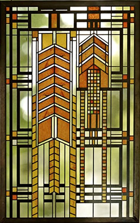 a stained glass window with an arrow design on the bottom and sides, in ...