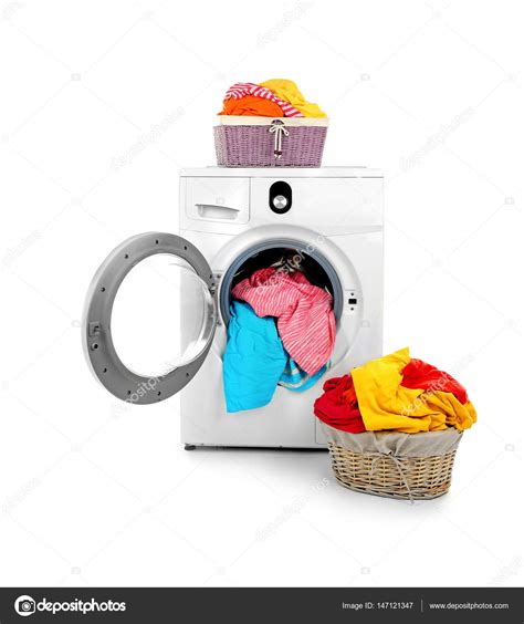 Clothes in washing machine Stock Photo by ©belchonock 147121347