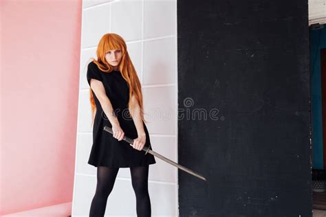 Portrait of a Beautiful Girl with a Japanese Sword Cosplayer Anime ...