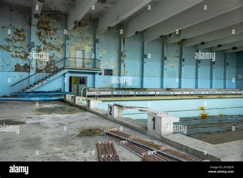 Derelict building indoors with abandoned swimming pool like Chernobyl ...