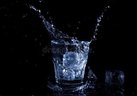 Water Splash in a Glass. a Glass of Cold Water Stock Photo - Image of ...