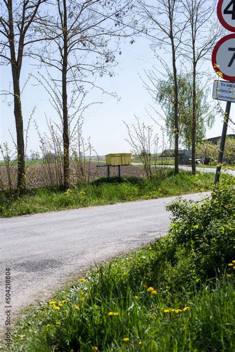 country road, with letterboxes and road signs Stock Photo | Adobe Stock