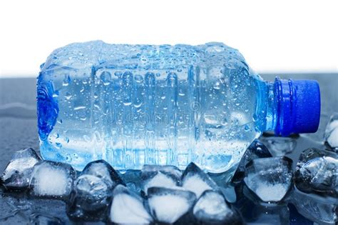 Cold Mineral Water Bottle With Ice Cubes Stock Image - Image: 14524379