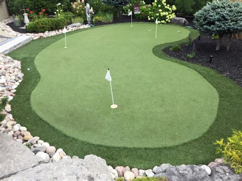 Curvey shaped golf green is a wonderful backyard addition for avid golfers