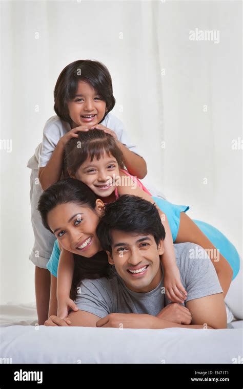 Portrait of family smiling Stock Photo - Alamy