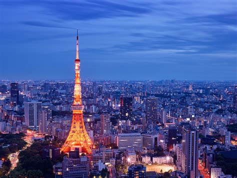 tokyo tower at dusk night lights blue sky city below from above long ...