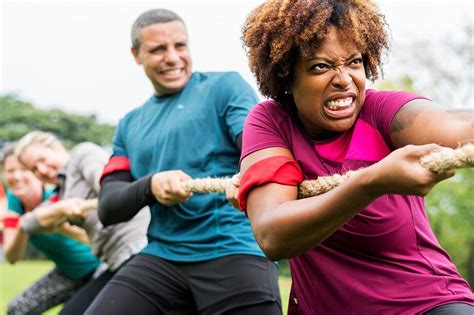 Team competing in tug of war | Photo - rawpixel