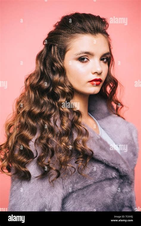 Healthy curls that look bouncy. Hair styling in beauty salon. Teenage ...