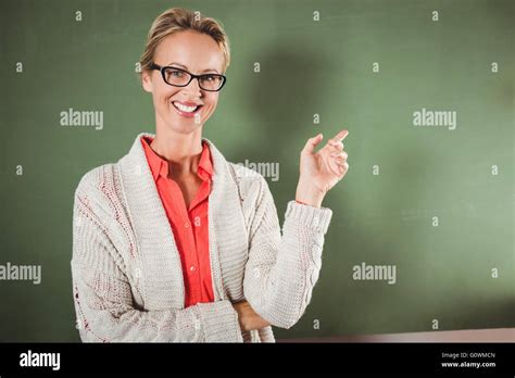 Teacher pointing blackboard hi-res stock photography and images - Alamy