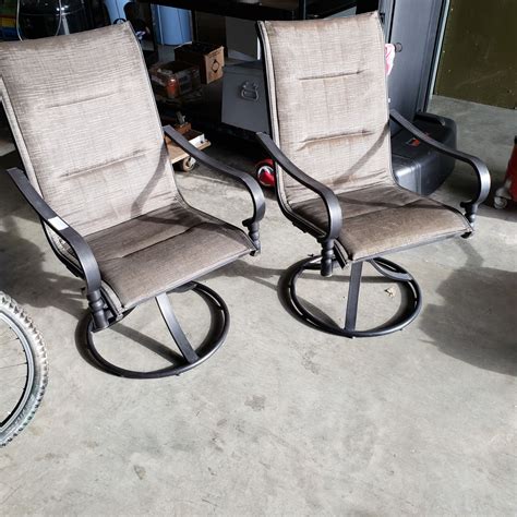 PAIR OF BLACK METAL PATIO CHAIRS W/ CUSHIONS