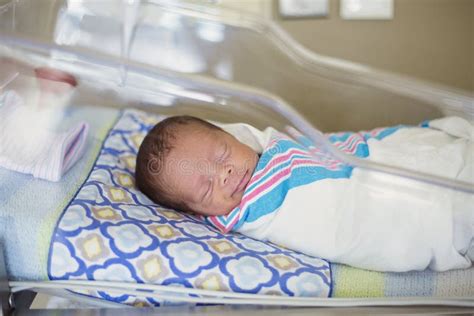 Happy Newborn Baby Boy Sleeping in a Hospital Room Bed Stock Image ...