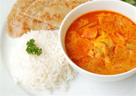 Chicken curry with rice and roti 805568 Stock Photo at Vecteezy