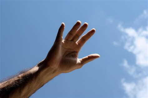 Premium AI Image | a hand reaching out to the sky