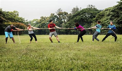 Team competing tug war | Premium Photo - rawpixel