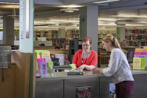 Worcester Public Library | Librarian assisting patron with h… | Flickr