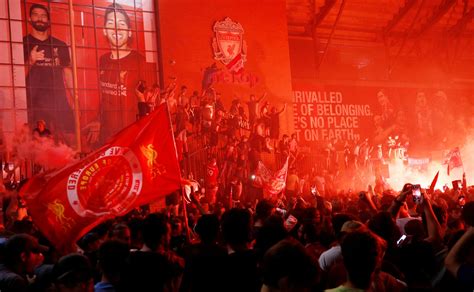 In pictures: Liverpool fans turn the city red after breaking 30-year ...