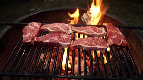 Steaks Grilling Over A Wood Fire - YouTube