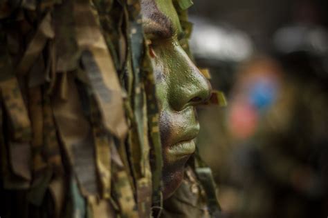 Close Up Photo of Soldier With Face Paint · Free Stock Photo