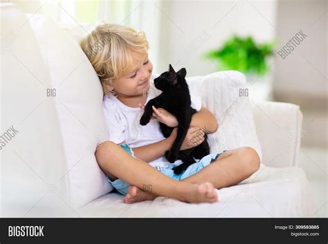 Child Playing Baby Cat Image & Photo (Free Trial) | Bigstock