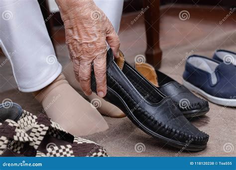 Elderly Woman Swollen Feet Putting on Shoes Stock Photo - Image of ...