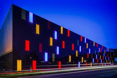 Colored BIPV facade with LED glass elements of OMICRON in Austria. Made ...