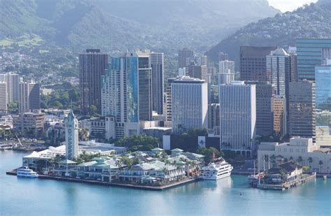 Downtown Honolulu buildings along Honolulu Harbor with Aloha Tow