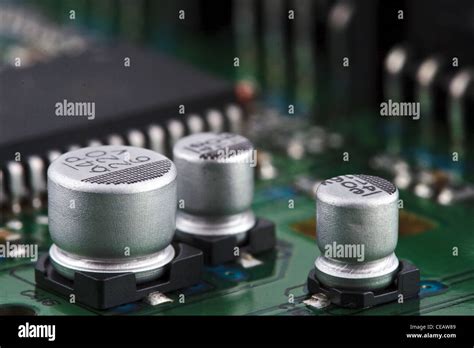 Capacitors on circuit board Stock Photo - Alamy