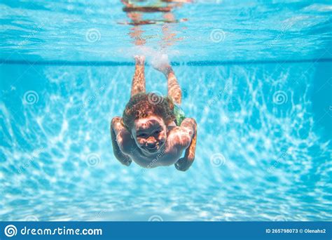 Child Swimming in Pool Underwater. Child Boy Swim Under Water in Pool ...