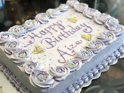 Cute Birthday Cake with White Frosting and Purple Icing