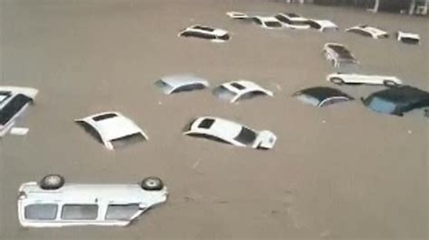 China flooding: Cars float down flooded road in Zhengzhou | World News ...