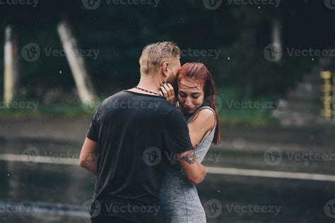 beautiful couple hugging in the rain 11781584 Stock Photo at Vecteezy