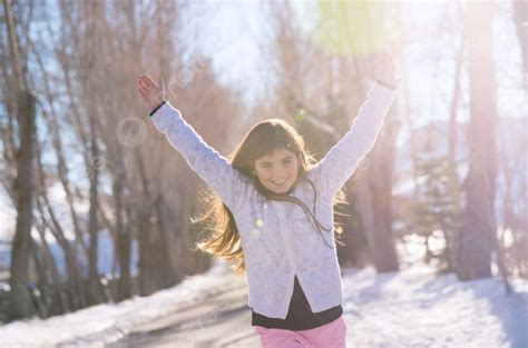 Beautiful Smiling Schoolgirl With Raised Up Hands Enjoying Warm Sunny ...