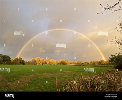 Full rainbow arch Stock Photo - Alamy