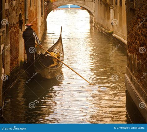 Venice gondolier in sunset stock photo. Image of travel - 37760828