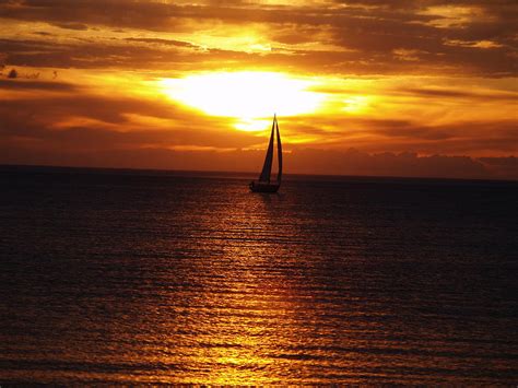 Boat At Sunset Photograph by Susan Buscho